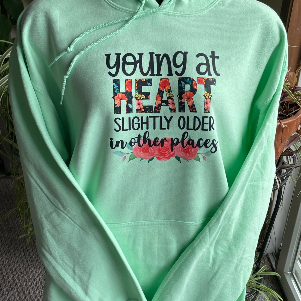 XL Gildan Hoodie Young at Heart Slightly older in other places